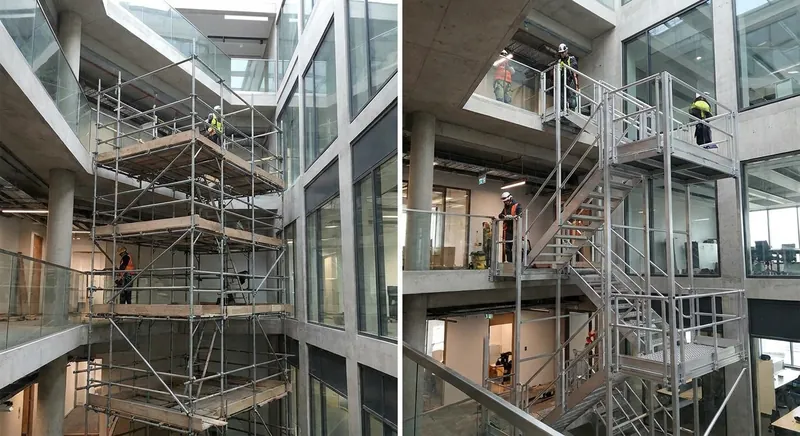 Aluminium-Fahrgerüst mit höhenverstellbaren Spindeln aufgebaut auf einer Treppe in einem Treppenhaus